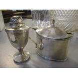 An early 20th century silver mustard pot together with a silver salt shaker