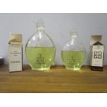 A large eau de toilette Jicky Guerlain scent bottle and another smaller, a 1980s Channel eau de