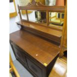 A late Victorian oak sideboard having a raised mirrored back 69"h x 54"w