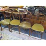 Two Victorian walnut balloon back dining chairs, together with two bedroom chairs