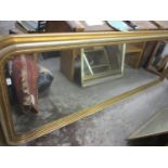 An early 20th century large gilt painted, floor standing /handing mirror, 106" h x 40"w