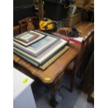 A mid 20th century South African hardwood dining table standing on ball and claw feet, together with