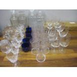 Glassware to include decanters, blue glass condiment liners and drinking glasses