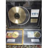 Three framed gold plated records to commemorate the World Wide Sales of Sgt Pepper by The Beatles