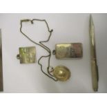 A gold coloured locket, two silver pendants and a Birmingham engine turned silver pencil