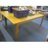 A large modern light oak dining table standing on block legs 30"h x 86"w, together with five benches