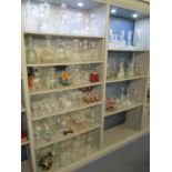 A large selection of mixed glassware to include approximately 52 decanters, coloured glass, a ship