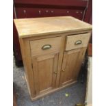An early 20th century pine cabinet with two drawers and two doors, 37" h x 29 1/2"w