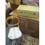 A vintage pig skin suitcase, together with a Victorian balloon back chair