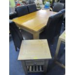 A modern light oak dining table standing on block shaped legs 31" x 51"w, together with six high