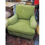 A modern Howard style armchair upholstered in green, on stained beech turned, tapered legs