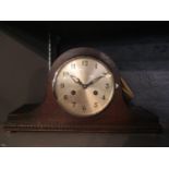 An early 20th century oak eight day mantle clock