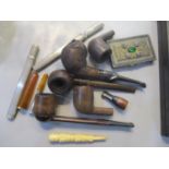 A mixed lot to include a silver cheroot holder, pipes and other items