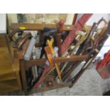 A 1930s stick stand, a quantity of miscellaneous walking canes and a fishing rod