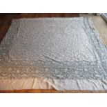 A 19th century Venetian lace bed cover with later alterations, 88" x 97", mounted on a cornflower
