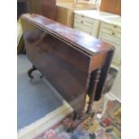 A Victorian rosewood gateleg table