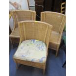 A pair of modern woven cane chairs and another