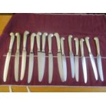 Eight large pistol grip silver handled knives, together with six small pistol grip silver handled