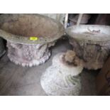 A pair of weathered composition stone garden urns with lion mask and swag ornament, 23 1/2"h x 21"w
