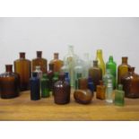 A collection of Victorian and later glass poison and other bottles