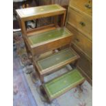 A late 20th century walnut finished metamorphic table/library steps with a green leather surface