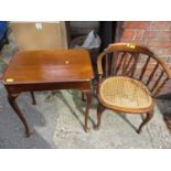 An early 20th century beech chair with a curved splat back and a caned seat, on cabriole legs and