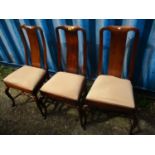 Three 19th century walnut splat back dining chairs with drop in seats, on cabriole legs