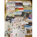 A collection of Isle of Man stamps, First Day Covers and postcards, together with mixed loose stamps