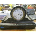 A Victorian black slate and green variegated marble cased mantle clock, with a white enamel Roman