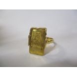 A ring inset with a bar stamped fine gold 999.9, the shank stamped 21K
