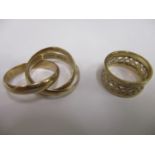 A 9ct gold Russian style wedding band and another pierced ladies dress ring, 11.33g