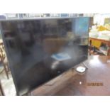 A Samsung HDMi 40" flatscreen television with a Now TV box