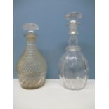 An early 19th century glass decanter with a mushroom shaped stopper, horizontal prismatic cut