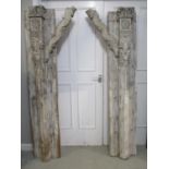 A pair of early 20th century Indo African white washed, carved hardwood door frame pillars, with