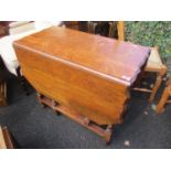 A 1930s oak gate leg table on barley twist legs, 29" h x 35 1/2"w