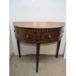 An early 19th century string inlaid and marquetry mahogany demi-lune side table with two pivoting