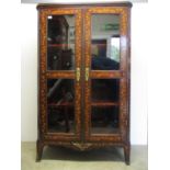 An 18th century Dutch inlaid marquetry, walnut display cabinet with a galleried top, over a pair