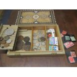 Coins to include Victorian shillings, crowns, pennies and American examples, containing in an inlaid