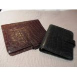 Two Mulberry Filofax cases of various sizes, one in black and one in brown