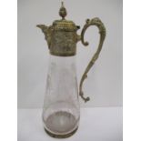 An Edwardian gilt metal and glass claret jug with grape and leaf design, the engraved glass body cut