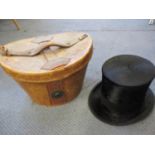 An Isaac Walton & Co Ltd black top hat, together with an early 20th century leather hat box A/F, 21"