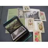 An album of vintage coastal town scenes and other postcards, together wit pre 1950s greeting cards