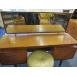 A retro G-Plan teak dressing table