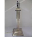 A silver table lamp, London 1937 by British Metallising Co Ltd with a flared top, square column