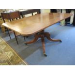 An early 20th century tilt top mahogany and rectangular table on a central pedestal support, 28" x