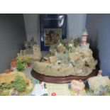 A quantity of Lilliput Lane cottages to include a Lighthouse village group