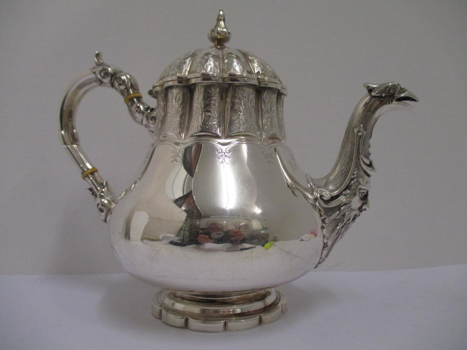 A Victorian silver teapot, London 1858, Henry Wilkinson, of oval form, the body chased with flowers,