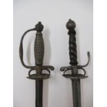 Two 18th century continental swords, one with a silver coloured metal grip and part gilt metal