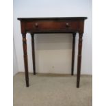 A Victorian mahogany side table with a drawer, on ring turned, tapered legs, 25 1/2"h, 23 1/2"w,