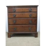 A George III mahogany dressing chest with a brushing slide and four graduated long drawers, on